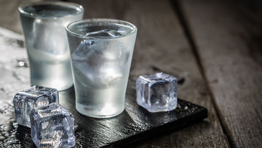Vodka on table with ice cube