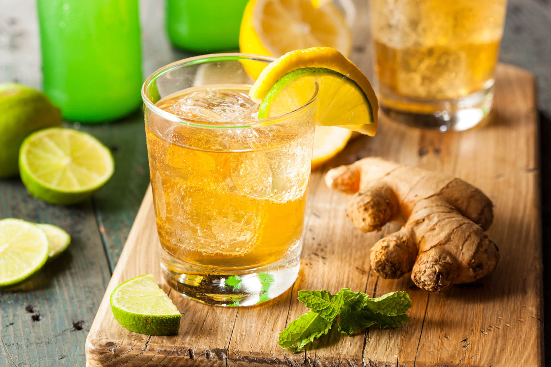Fruity cocktail with ginger, lemon, lime and mint