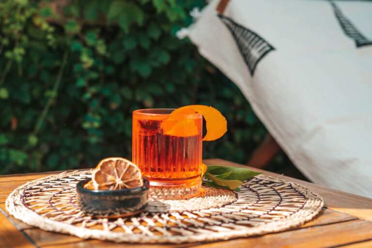 Glass of negroni on outside table